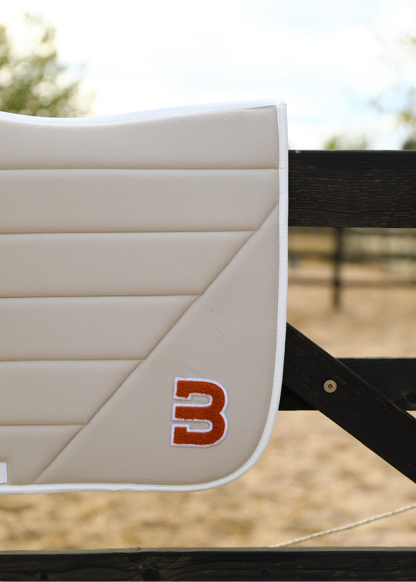 Beige Teddy saddle pad jumping