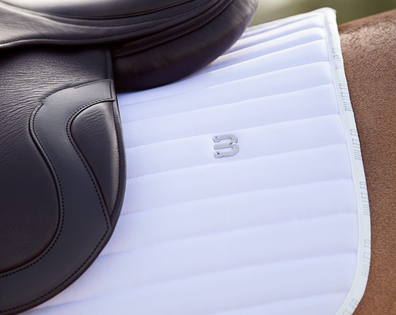 white saddle pad dressage